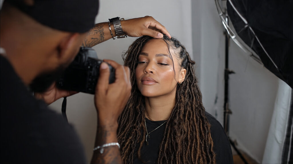 A loctician documenting before and after photos of loc grooming for their professional portfolio.